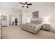 Main bedroom with a comfortable bed, nightstands, and an ensuite bathroom at 10756 E Ludlow Dr, Scottsdale, AZ 85255