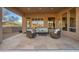 Relaxing stone patio with seating area, offering an outdoor oasis at 10756 E Ludlow Dr, Scottsdale, AZ 85255