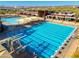 Community pool area with lap lanes, a leisure pool, and a water slide at 10756 E Ludlow Dr, Scottsdale, AZ 85255