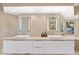 Elegant bathroom featuring double sinks and modern fixtures at 10758 E Tamarisk Way, Scottsdale, AZ 85262