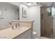 Clean bathroom with single vanity and walk-in shower at 10758 E Tamarisk Way, Scottsdale, AZ 85262