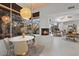 Bright dining area with large windows and fireplace at 10758 E Tamarisk Way, Scottsdale, AZ 85262