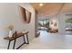 View of living room and entry hall with modern console table and decor at 10758 E Tamarisk Way, Scottsdale, AZ 85262