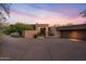 Modern home with stucco exterior and large garage at 10758 E Tamarisk Way, Scottsdale, AZ 85262