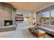 Living room with fireplace, built-in media console, and comfortable seating at 10758 E Tamarisk Way, Scottsdale, AZ 85262