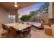 Outdoor patio with dining area and fire pit at 10758 E Tamarisk Way, Scottsdale, AZ 85262