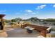 Community patio with fire pit and pool view at 10758 E Tamarisk Way, Scottsdale, AZ 85262