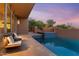 Stunning pool and spa with tiled deck and lounge chairs, at sunset at 10758 E Tamarisk Way, Scottsdale, AZ 85262