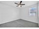 Well-lit bedroom with ceiling fan and window at 1135 E Westwood Dr, Casa Grande, AZ 85122