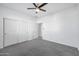 Bright bedroom with ceiling fan and closet at 1135 E Westwood Dr, Casa Grande, AZ 85122