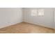 Simple bedroom with tile flooring and a window with blinds at 11793 W Larkspur Rd, El Mirage, AZ 85335