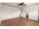 Spacious bedroom with wood-look floors and ceiling fan at 11793 W Larkspur Rd, El Mirage, AZ 85335