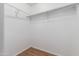 Spacious closet with double hanging rods and wood flooring at 11793 W Larkspur Rd, El Mirage, AZ 85335