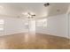 Bright living room with tile floors and ceiling fan at 11793 W Larkspur Rd, El Mirage, AZ 85335