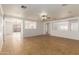 Bright living room with tile floors and ceiling fan at 11793 W Larkspur Rd, El Mirage, AZ 85335