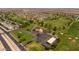 Aerial view of golf course, clubhouse, and neighborhood at 12719 W Shadow Hills Dr, Sun City West, AZ 85375