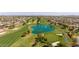 Aerial view of a golf course with a pond at 12719 W Shadow Hills Dr, Sun City West, AZ 85375