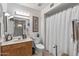 Simple bathroom with a shower/tub combo and wood vanity at 12719 W Shadow Hills Dr, Sun City West, AZ 85375