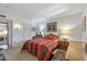 Bedroom with wood furniture and striped bedding at 12719 W Shadow Hills Dr, Sun City West, AZ 85375