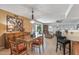 Dining area with glass table and adjoining kitchen at 12719 W Shadow Hills Dr, Sun City West, AZ 85375