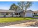 Ranch style home with landscaped lawn and attached garage at 12719 W Shadow Hills Dr, Sun City West, AZ 85375