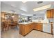 Well-equipped kitchen featuring wood cabinetry and an island at 12719 W Shadow Hills Dr, Sun City West, AZ 85375