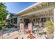 Covered patio features seating area, ceiling fan, and grill at 12719 W Shadow Hills Dr, Sun City West, AZ 85375