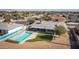 Aerial view showcases the home's location and backyard pool at 13034 N 98Th Dr, Sun City, AZ 85351