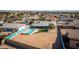 Aerial view showing the home's backyard oasis and surrounding neighborhood at 13034 N 98Th Dr, Sun City, AZ 85351