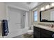 Bathroom with tub, shower, and granite vanity at 13034 N 98Th Dr, Sun City, AZ 85351