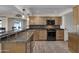 Updated kitchen with granite countertops and modern appliances at 13034 N 98Th Dr, Sun City, AZ 85351