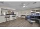 Living room with hardwood floors and access to kitchen at 13034 N 98Th Dr, Sun City, AZ 85351