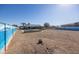 Large backyard with a refreshing pool and a painted wall at 13034 N 98Th Dr, Sun City, AZ 85351