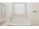 Close-up of luxurious tub in bathroom with neutral finishes, plus a window for plenty of natural light at 1328 E Binner Dr, Chandler, AZ 85225