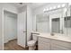 Bright and updated bathroom with a vanity, mirror, toilet, and shower with tile surround at 1328 E Binner Dr, Chandler, AZ 85225