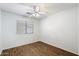 Simple bedroom with wood-look floors and a ceiling fan at 1328 E Binner Dr, Chandler, AZ 85225