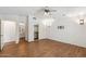 Primary bedroom with wood-look floors, ceiling fan, and ensuite bathroom at 1328 E Binner Dr, Chandler, AZ 85225