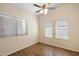 Well-lit bedroom with wood-look floors and three windows at 1328 E Binner Dr, Chandler, AZ 85225