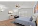 Bright bedroom with wood-look floors, ceiling fan, and large window at 1328 E Binner Dr, Chandler, AZ 85225