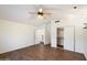 Spacious bedroom with wood-look floors, ceiling fan, and ample closet space at 1328 E Binner Dr, Chandler, AZ 85225