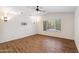 Bright bedroom with wood-look floors and a view of the pool in the backyard at 1328 E Binner Dr, Chandler, AZ 85225