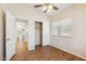 Comfortable bedroom with a ceiling fan, closet, and wood floors, creating a cozy living space at 1328 E Binner Dr, Chandler, AZ 85225