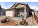 Tan two-car garage home with front porch and landscaping at 1328 E Binner Dr, Chandler, AZ 85225