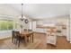 Bright kitchen and dining area featuring white cabinetry, wood countertops, and wood-look flooring at 1328 E Binner Dr, Chandler, AZ 85225
