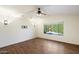 Living room with hardwood floors, a ceiling fan, and pool view at 1328 E Binner Dr, Chandler, AZ 85225