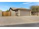 Street view showcasing the home's exterior, neutral color palette, desert landscaping and private fenced patio at 14 E Peppergrass Pl, San Tan Valley, AZ 85143