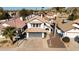 House with a gray garage door, terracotta tile roof, and surrounding homes at 1436 E Rosemonte Dr, Phoenix, AZ 85024