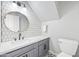 Modern bathroom with hexagon tile and a white marble countertop at 1436 E Rosemonte Dr, Phoenix, AZ 85024