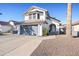 Two-story house with gray garage doors and a landscaped front yard at 1436 E Rosemonte Dr, Phoenix, AZ 85024