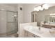 Bathroom with double sinks, a large mirror, and a walk-in shower at 15050 N Thompson Peak Pkwy # 1010, Scottsdale, AZ 85260